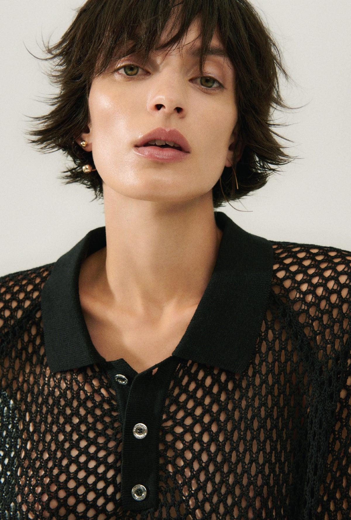 Polo raglan en crochet noir